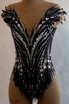 a mannequin with black and white sequins on it's body