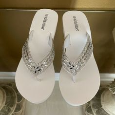 Olivia Miller Women’s Miramar Jewel Thong Eva Wedge Sandal White Size 7 Nwb Arm Yourself With Beach-Ready Style In This Lovely Wedge Sandal With Sparkling Gem Details. Classic Wedge Design Adds Height And The Cupped Footbed Brings A Comfy Fit. Heel Height- 2" Medium Width Slip On Jeweled Upper Polyurethane, Ethylene Vinyl Acetate White Toe Post Wedge Sandals For Beach, White Toe Post Wedge Sandals For Summer, Silver Synthetic Wedge Sandals For Vacation, White Wedge Heel Flip Flops For Beach, Silver Wedge Sandals For Vacation, Silver Wedge Sandals For Summer Vacation, Silver Wedge Heel Sandals For The Beach, Synthetic Wedge Toe Post Sandals, White Wedge Heel Flip Flops For Spring