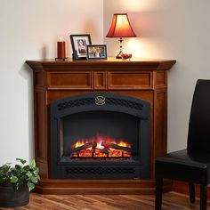 a living room with a fire place in the center and a chair next to it