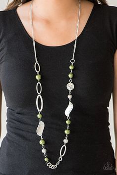 Over sized green pearls, ornate silver beads, and an array of glistening silver accents trickle along a lengthened silver chain for a refined look. Features an adjustable clasp closure.  Sold as one individual necklace. Includes one pair of matching earrings. Elegant Green Jewelry With Silver Beads, Elegant Silver Beaded Necklace With Dangling Beads, Green Metal Jewelry With Silver Beads, Elegant Green Beaded Necklaces With Dangling Beads, Elegant Green Necklaces With Dangling Beads, Silver Pearl Beaded Necklace With Dangling Beads, Silver Pearl Jewelry With Dangling Beads, Elegant Green Necklace With Dangling Beads, Elegant Silver Nickel-free Beaded Necklace