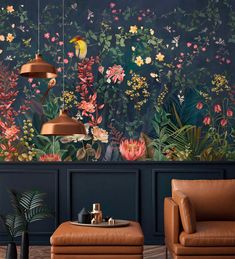 a living room with floral wallpaper and leather chairs