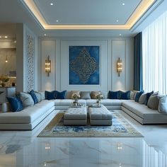 a large living room with white couches and blue pillows on the walls, along with an area rug