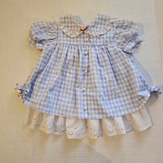 Vintage blue gingham and ruffle, toddler dress. Tagged 18 months Measures 16" shoulder to bottom hem Cute Ruffled Plaid Dress For Spring, Blue Plaid Ruffle Dress For Spring, Blue Plaid Dress With Ruffles For Spring, Cotton Gingham Plaid Dress With Ruffles, Gingham Plaid Cotton Dress With Ruffles, Cute Gingham Dresses With Lace Trim, Picnic Gingham Dress With Lace Trim, Baby Clothes Aesthetic, Kids Nostalgia