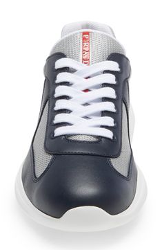 Made from leather and breathable mesh, this low-top sneaker was originally designed for the Luna Rossa sailing team to wear during the 2000 America's Cup. Lace-up closure Removable insole Textile and leather upper and lining/rubber sole Made in Italy Men's Designer Shoes America's Cup, Americas Cup, Mens Designer Shoes, Sneaker Men, Low Top, Designer Shoes, High Top Sneakers, Rubber Sole, Sailing