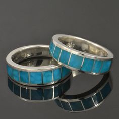 two wedding bands with blue turquoise inlays