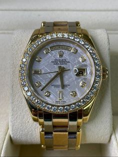 Cali Jewelers Fine Jewelry & High-End Watches Rolex Day-Date Tridor Masterpiece 39MM Ref. R18948 Meteorite Diamond Dial  FREE Insured Express Shipping Warranty 14 Day Return Policy FREE Luxury Gift Box Rolex Day-Date Tridor Masterpiece 39MM Ref. R18948 Meteorite Diamond Dial     This watch comes with Rolex Box & Booklet!   Item Description: Brand: Rolex Model: Day-Date Masterpiece Reference: 18948 Bracelet: Rolex Tridor Bracelet Bezel: Factory Rolex Diamond Bezel Material: Yellow Gold Case Material: Yellow Gold Case Size: 39MM Condition: Mint  Dial: Meteorite w/ Factory Rolex Diamond Indices     For More Info Contact Cali Jewelers of Beverly Hills Today! Payment Shipping & Taxes Return Policy About Payment Shipping & Taxes Return Policy About   We accept payment by any of the following met Gold Rolex With Bracelets, Rolex Diamond, Gold Rolex, Rolex Models, High End Watches, Luxury Gift Box, Gold Case, Rolex Day Date, Bezel Diamond