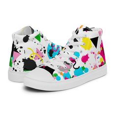 Whether you're feeling nostalgic or looking to rock the retro vibe, these canvas high-tops feature original splatter paint art, and will quickly become a favorite addition to your wardrobe. Each shoe features a slightly different design - one with black paint splatters and neon shapes, the other with neon splatters and black and gray shapes - similar enough to be called a pair, but different enough to make people do a double-take! Also available in low tops, slip-ons, and combat-style boots, get yours before they sell out! (Links below) This product is made especially for you as soon as you place an order, which is why it takes us a bit longer to deliver it to you. Making products on demand instead of in bulk helps reduce overproduction, so thank you for making thoughtful purchasing decisi Multicolor Paint Splatter Sneakers For Streetwear, Casual Lace-up Paint Splatter Sneakers, Casual High-top Sneakers With Paint Splatter, Casual Multicolor Paint Splatter Sneakers, Multicolor Sneakers With Paint Splatter And Round Toe, Casual Paint Splatter Sneakers For Spring, Retro High-top Sneakers For Spring Streetwear, Funky High-top Sneakers For Spring, Retro Canvas Shoes With Speckled Midsole And Round Toe