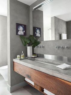 a bathroom with two sinks and a large mirror above the sink in front of it