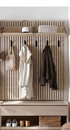 a coat rack with several coats hanging on it