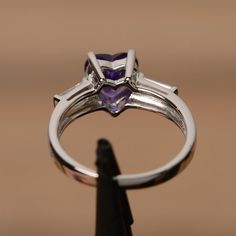 It is real natural amethyst ring, the heart amethyst gemstone is about 8mm*8mm.The basic metal is sterling silver and plated with rhodium.To change the metal to a solid gold (white/rose) or platinum is also available, please ask for a quotation if you want.You can also go to my shop Home for more elegant rings: https://www.etsy.com/shop/godjewelry?ref=hdr_shop_menuAmethyst is the birthstone of January. More amethyst rings:https://www.etsy.com/shop/godjewelry?ref=hdr_shop_menu&section_id=2070 Purple Brilliant Cut Ring, Purple Brilliant Cut Ring As Gift, Purple Heart Ring For Anniversary, Purple Brilliant Cut Rings For Promise, Fine Jewelry Amethyst Ring Heart Cut, Fine Jewelry Heart Cut Amethyst Ring, Brilliant Cut Amethyst Ring In Sterling Silver For Promise, Amethyst Ring In Brilliant Cut Sterling Silver For Promise, Sterling Silver Amethyst Ring With Brilliant Cut For Promise