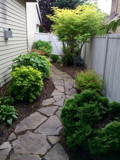 a stone path in front of a house