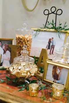 a table topped with pictures and candies