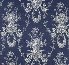 a blue and white floral pattern on fabric