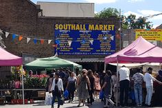 many people are standing in line at the market