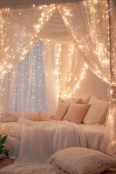 a bed with lights hanging from it's headboard and pillows on the floor