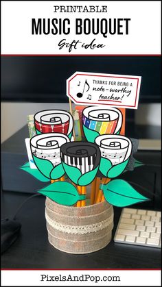 this is an image of a music bouquet made out of paper and pencils with the words printable music bouquet on it