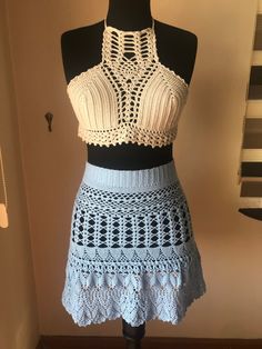 This very stylish bustier and skirt, which you can wear in any space you can imagine, adds a different qualitiy and excitement to your combinations. Whether it's on a nice dinner or on the beach.. I recommend you be ready to be dazzled.  Yarn Skirt: 8% Pbt Elastic, 92% Mycrofiber Acrylic, Baby Blue Colored Bustier: 100% Cotton, Beige Colored Skirt Lenght : 45cm Hip Widht : 80cm Waist Widht : 64cm Size Small / Medium Competible.  CARE INSTRUCTIONS: Dry Clean Only, Do not hang SHIPPING BY DHL,UPS Traditional Fitted Skirt For Beach, Traditional Beach Fitted Skirt, Handmade Fitted Bohemian Skirt, Bohemian Fitted Skirt For Vacation, Fitted Hippie Skirt For Festival, Blue Fitted Skirt For Festival, Bohemian Maxi Skirt For Party, Traditional Fitted Beach Skirt, Hippie Festival Fitted Skirt