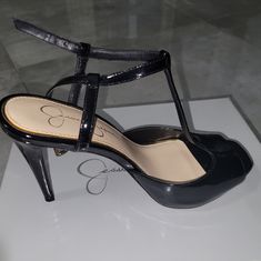 Nwt Jessica Simpson Black Patent Heeled Sandals Sz 8.5 4 Inch & 1/2 Inch Heels Never Been Worn, Only Tried On At Home. Closed Toe Patent Leather Sandals For Night Out, Chic T-strap Heels In Synthetic Material, Black T-strap Heels For Night Out, Fitted Black Patent Leather Sandals, Platform T-strap Heels For Evening, Black T-strap Heels For Spring, Chic Synthetic T-strap Heels, Elegant Patent Leather Lace-up Heels, Black T-strap Heels With Heel Strap