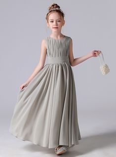 Draped in elegance, this flower girl dress is a perfect blend of timeless charm and modern sophistication. The dress features a beautifully pleated bodice that adds a touch of refinement and texture to the design. The sleeveless style is both chic and practical, ideal for warmer seasons and providing a comfortable fit. A wide satin waistband cinches at the waist, creating a lovely, defined silhouette that enhances the overall elegance of the dress. The skirt flows into a full, floor-length desig Chiffon Flower Girl Dress, Junior Bridesmaids, Tutu Birthday, Green Tulle, Junior Bridesmaid Dress, Baby Flower, Chiffon Flowers, Clothing Catalog, Childrens Dress