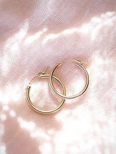 Everyday Gold Hoop Earrings. These classic 14kt gold filled hoop earrings feature a smooth finish and come in two sizes. Grab one or both pairs and wear them all day, everyday. They're sure to become as valuable as your favorite white tee.✧ Name: Ahulani (AH hoo LA nee) - Sky alter.✧ You will receive 1 pair of hoops.✧ Small: 15mm x 2mm thick; 12mm Inner Diameter.✧ Medium: 22mm x 2mm thick; mm Inner Diameter.✧ 14kt Gold Filled with Latch.✧ All Ke Aloha Jewelry pieces come packaged thoughtfully, b Classic Small Hoop Earrings In 14k Gold Filled, Nickel-free Small Hoop Earrings In 14k Gold, Nickel-free Small Hoop 14k Gold Earrings, Small Hoop 14k Gold Nickel-free Earrings, Nickel-free 14k Gold Small Hoop Earrings, Nickel-free 14k Gold Hoop Earrings, Nickel-free 14k Gold Hoop Earrings For Everyday, 14k Gold Nickel-free Hoop Earrings For Everyday, Classic Round Hoop Earrings In 14k Gold Filled