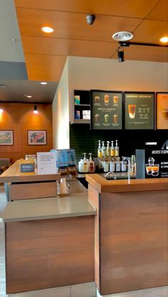 an empty restaurant counter with drinks on it