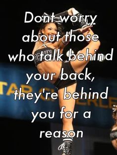 a woman is doing a trick on the stage with words above her that read, don't worry about those who talk behind your back, they're behind you're behind you for a reason