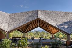 an outdoor pavilion with tables and benches