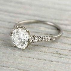 a white gold engagement ring with an oval cut diamond