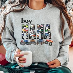 This Cozy Boy Mama Matching Sweatshirt and t-shirt with Big Monster Trucks Theme  is sure to be a favorite gift for mom and son.  Perfect for boy baby shower gifts or new mom boy gifts, boys birthday or mom's birthday. These Matching Mother and Son Mama's Boy shirts are too cute and can be paired with Boy Mama Sweatshirt.  Also Tees and Baby Bodysuits.  MATCHING COMFORT COLORS SHORT AND LONG SLEEVES: https://www.etsy.com/listing/1496514221 FOR MATCHING COMFORT COLORS SWEATSHIRTS: https://www.ets Graphic Print Sweatshirt For Birthday And Mother's Day, Mother's Day Birthday Graphic Print Sweatshirt, Casual Sweatshirt For Birthday And Mother's Day, Mother's Day Birthday Crew Neck Sweatshirt, Monster Truck Jam, Big Monster Trucks, Boy Mom Shirt, Big Monster, Mom Crewneck