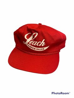 a red hat with the words peach on it