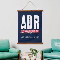 a living room with two couches and a poster on the wall that says adr but handling it add additional text