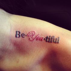 a woman's arm with the words be beautiful written in cursive font