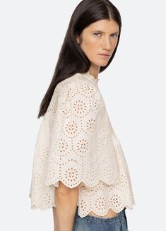 The Lainey embroidered short sleeve top features delicate eyelet embroidery throughout, short puff sleeves and scalloped hemline. Details: self-100% cotton embroidery-100% polyester button back fastening designed for a relaxed fit style #AW24-036 model is 5'10'' and wearing a size S Eyelet Shirt, Sea Ny, Eyelet Embroidery, Denim Outerwear, Eyelet Top, Cotton Embroidery, Embroidered Shorts, Outerwear Sweater, Kids Sleepwear