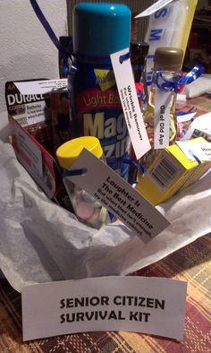 a bunch of items that are sitting in a basket on a table with a sign