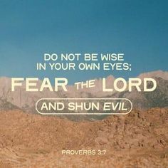 the words fear the lord and shun evil appear to be in front of mountains