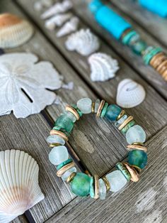 Introducing the Twine & Twig TIDES Collection. From the hues off the coast of Belize to the crystal clear waters of the Bahamas and the impeccable blue-green shades in the seas around Thailand - we cannot help but be drawn to these incredible blue tones. We could watch the range of blue hues come in and out with the tide anywhere in the world and be in complete awe of mother nature's canvas. This eye catching capsule will give you the beachy vibes you've been dreaming of all summer with its use Spiritual Beaded Jewelry With Recycled Glass, Spiritual Stretch Bracelet With Large Beads For Beach, Spiritual Stackable Stretch Bracelet For Beach, Turquoise Recycled Glass Round Bead Jewelry, Turquoise Recycled Glass Bead Jewelry, Spiritual Stackable Beaded Bracelets For Beach, Recycled Glass Large Beads Bracelet Gift, Spiritual Beaded Bracelets With Recycled Glass, Hand-strung Recycled Glass Beaded Bracelets