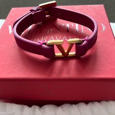 New, Never Worn, Valentino Fuschia Leather Bracelet With Gold “V” Luxury Leather Jewelry With Logo Charm, Designer Adjustable Pink Bracelets, Designer Pink Adjustable Bracelets, Designer Adjustable Pink Bracelet, Designer Leather Bracelets, Designer Jewelry With Leather Strap As Gift, Luxury Pink Jewelry With Logo Charm, Designer Pink Bracelets For Formal Occasions, Designer Leather Jewelry For Gift