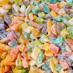 a pile of colorful gummy bears sitting next to each other