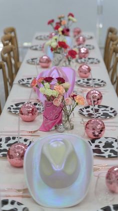 the table is decorated with pink and white flowers