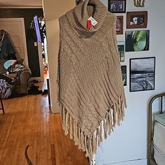 Tan, Turtleneck, Knitted Poncho. Kelly & Katie Brand. Never Been Worn. Still Has Original Tags. Beige Knit Poncho, Beige Knit Poncho One Size, One-size Beige Knit Poncho, One Size Chunky Knit Poncho, One Size Knit Poncho, Cable Knit Poncho One Size, One Size Cable Knit Poncho, Tan Turtleneck, Turtleneck Poncho