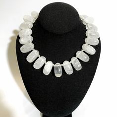 This is a handcrafted necklace of Rock Crystal, natural stone beads knotted to the shape of the neck.  The Creeks gave its name "Crystal," meaning "ice."  Wearing quartz crystals has been associated with clarity and energy and benefits spiritual well-being.  The necklace is 16 inches long and weighs 9 ounces. White Adjustable Gemstone Beaded Necklace, White Adjustable Beaded Necklace With Gemstone, White Adjustable Gemstone Beaded Necklaces, Adjustable White Gemstone Beaded Necklaces, White Adjustable Crystal Gemstone Necklace, Adjustable White Gemstone Crystal Necklace, Adjustable White Crystal Gemstone Necklace, White Crystals For Jewelry Making, Adjustable White Crystal Necklace With Faceted Beads