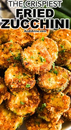 fried zucchini on a white plate with the title overlay reads, the crispest fried zucchini