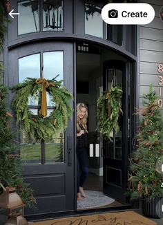 a woman standing in front of a door with christmas wreaths on it and the words create