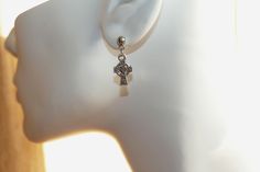 "Antique silver tone double sided small cross charm earrings. Earring length: 24mm (including the ball); 1\" Cross size: 15mm x 9mm Stud material: stainless steel This listing is for one pair of cross earrings with rubber backs. This earring will come in a gift bag. I offer combined shipping costs which give you a shipping discount for ordering multiple items from my shop. Earrings care: Take them off while you sleep, sports activities, bathing, having a shower. Avoid contact with chemicals, hig Nickel Free Adjustable Cross Earrings, Metal Cross Pendant Earrings As Gift, Hypoallergenic Stainless Steel Cross Jewelry, Cheap Single Cross Earring, Silver Single Earring With Cross Pendant, Metal Cross Pendant Earrings For Gift, Silver Cross Pendant Pierced Earrings, Silver Single Cross Earring, Silver Metal Cross Pendant Earrings