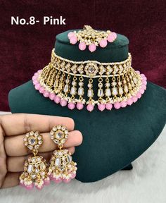 *Light Weight kundan choker necklace set. *Beautiful & Light in weight. *Necklace width: 2.2 inches (included drops) *Earrings length: 2.1 inches  (with drops)   *Dome width- 0.9 inches Pink Kundan Choker For Festivals, Pink Choker For Diwali Gift, Bollywood Pink Choker For Diwali, Pink Bollywood Choker For Festivals, Festive Pink Meenakari Choker, Bollywood Style Pink Choker For Festivals, Pink Choker For Party And Festivals, Pink Party Choker For Festivals, Pink Kundan Choker Necklace