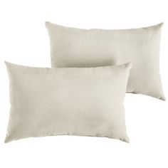 two white pillows sitting next to each other