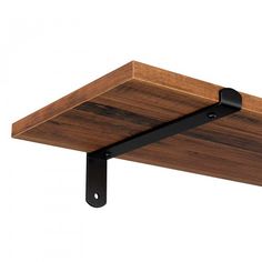 a wooden shelf with metal brackets on it