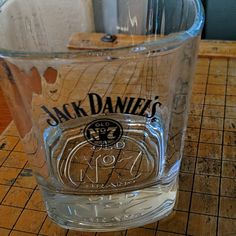 a jack daniels glass sitting on top of a counter