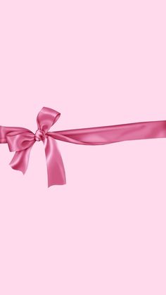 a pink ribbon with a bow on it