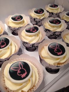 cupcakes with white frosting and pink icing on the top are decorated with bunny ears